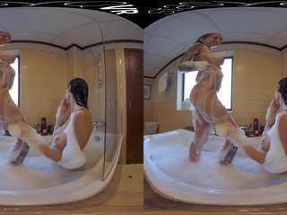 Fabulous Busty Lesbian Lovers taking a Steamy Bubble Bath in this VR clip